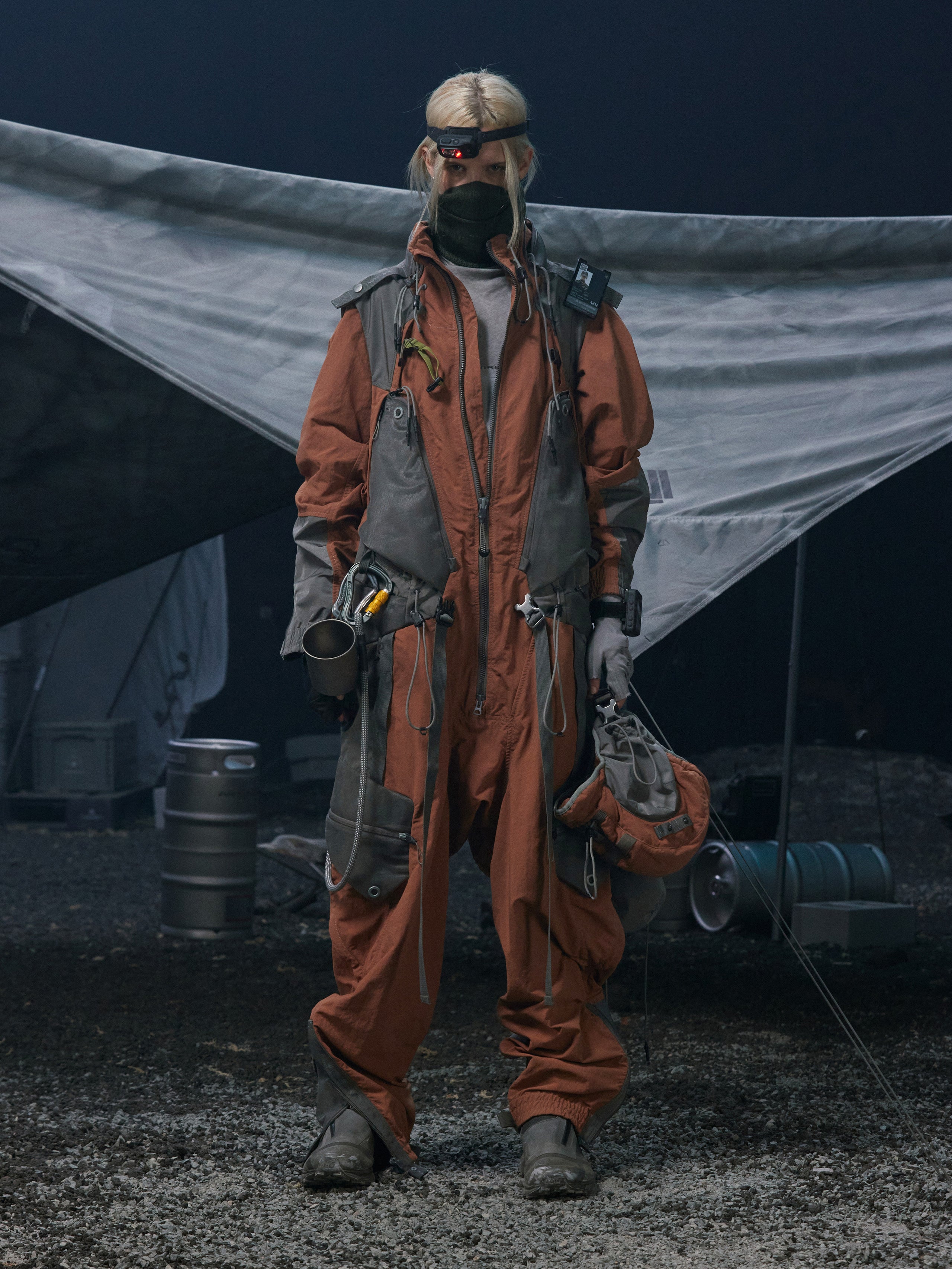 Cyberpunk street scene with humans in anti-contamination suits