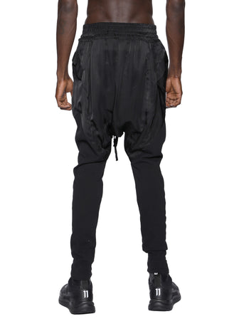 DROP-CROTCH GEOCUT KNIT CALVES PANEL SAROUEL PANTS / BLACK